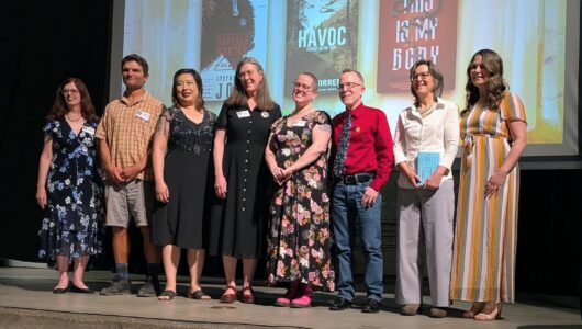 A group of writers stand on stage at the 2026 Colorado Book Awards Ceremony.