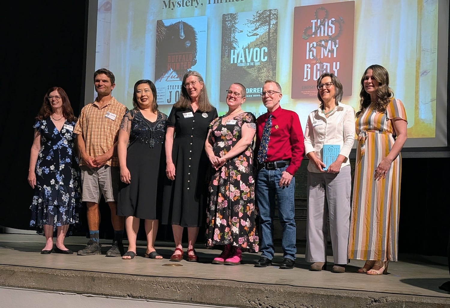 A group of writers stand on stage at the 2026 Colorado Book Awards Ceremony.