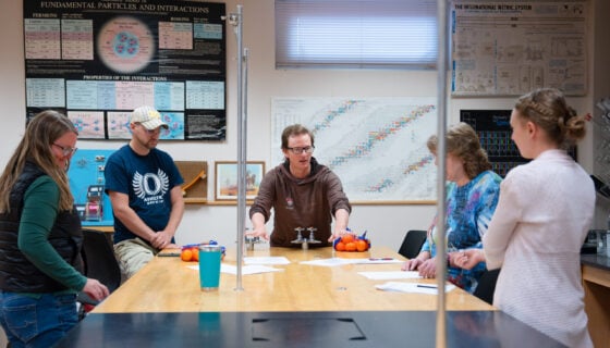 John Mason explains a cheap engineering exercise the teachers taking his class can use in their own classrooms with cuties and sheets of paper.