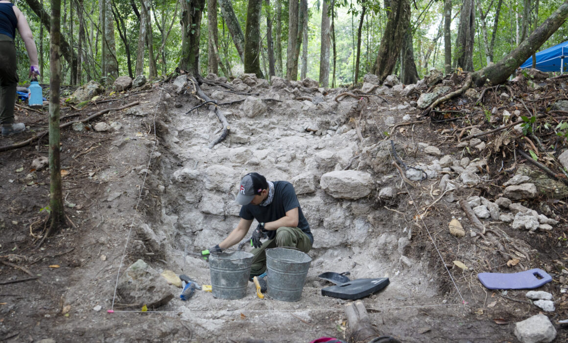 A student works on an excavation of a Maya building during the Maya Archaeological Field School in Belize.