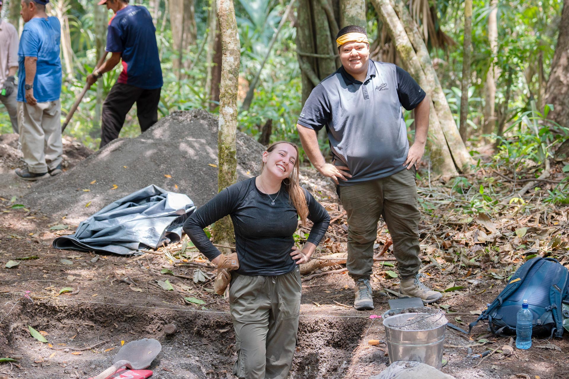 Two students take a pause from working and smile for a photo during the Maya Archaeological Field School in Belize.