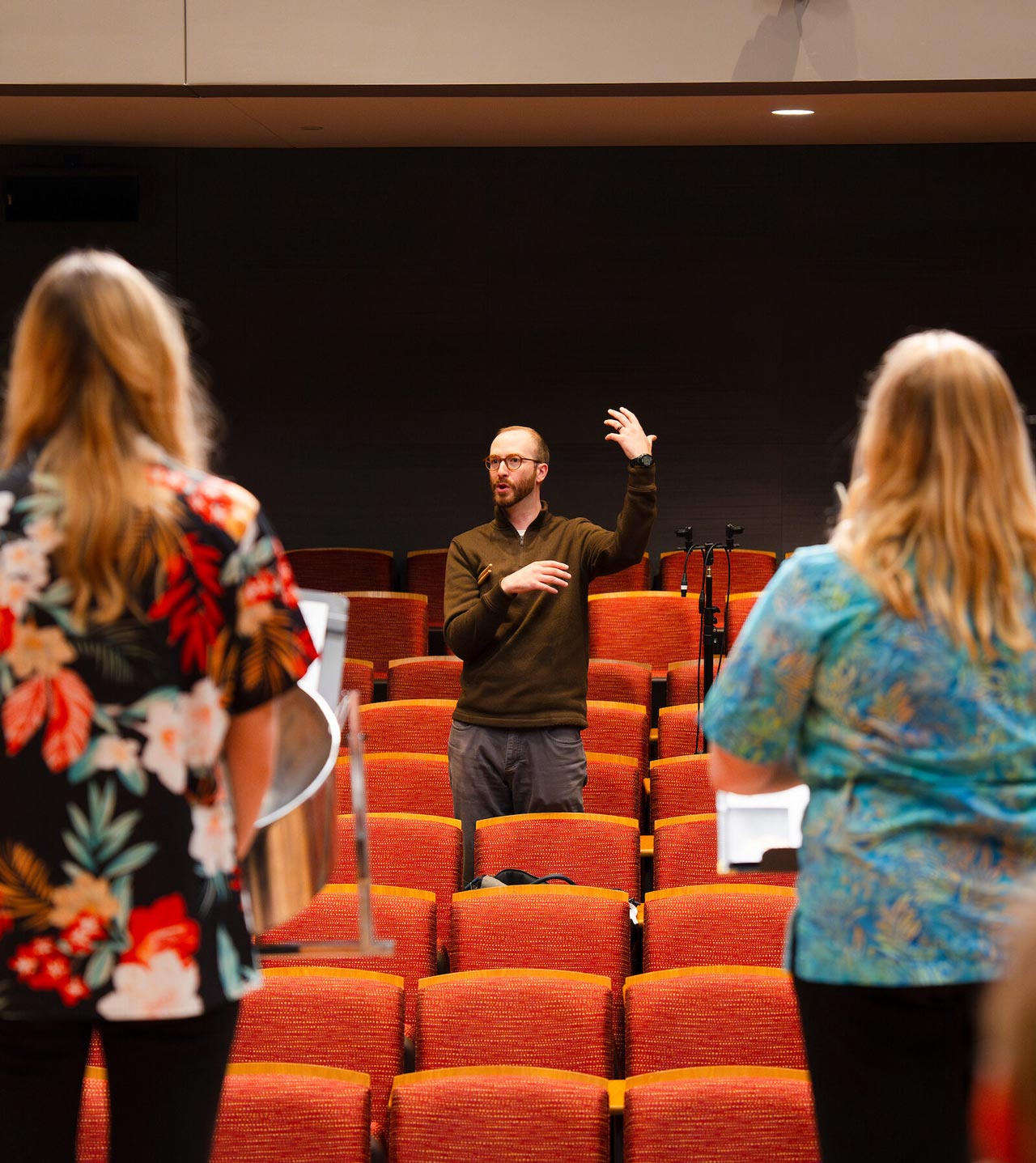 Music professor Ben Justis instructs the steel band during a practice in Kincaid Concert Hall.