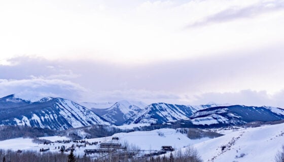 Students from Western Colorado University skin up Mt. Crested Butte at sunset.
