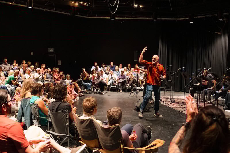 Steven Cole Hughes addresses a full audience in the Taylor Hall Studio Theatre before a performance of the musical he wrote, 'Singletrack! The Musical'.
