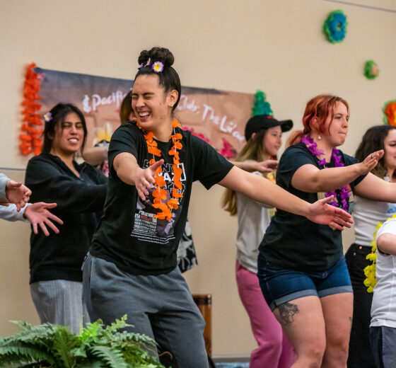 Students dance during the campus Luau.