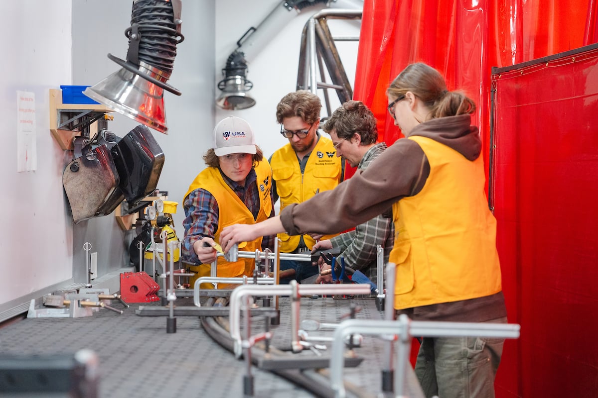 Mechanical Engineering students create a rail with their professor for Rail Jam in the Maker Space in the Rady Building.