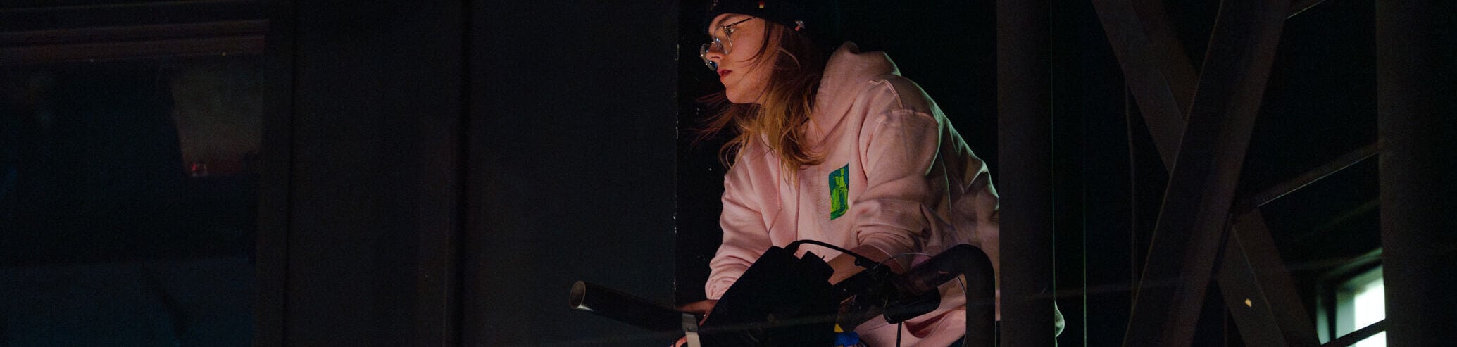 A student works on the lighting for the stage during the play Tartuffe.