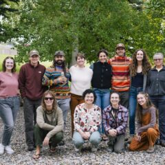Group photo of students from various cohorts, faculty, and support staff of the NSF EMPLOYS program outside near the north patio of the Clark Family School of Environment & Sustainability.