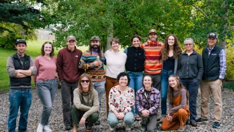 Group photo of students from various cohorts, faculty, and support staff of the NSF EMPLOYS program outside near the north patio of the Clark Family School of Environment & Sustainability.