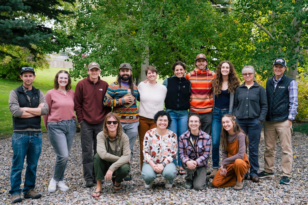 Group photo of students from various cohorts, faculty, and support staff of the NSF EMPLOYS program outside near the north patio of the Clark Family School of Environment & Sustainability.
