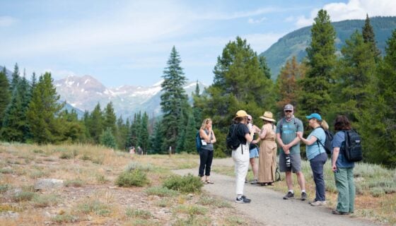 Graduate students and faculty in the GPCW's Nature Writing concentration converse while hiking on the Lower Loop Trail.