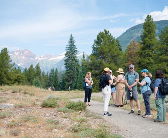 Graduate students and faculty in the GPCW's Nature Writing concentration converse while hiking on the Lower Loop Trail.