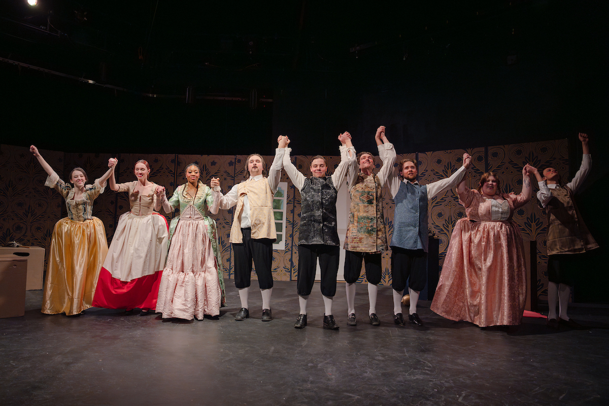 The Tartuffe cast bows in a row at the end of their performance