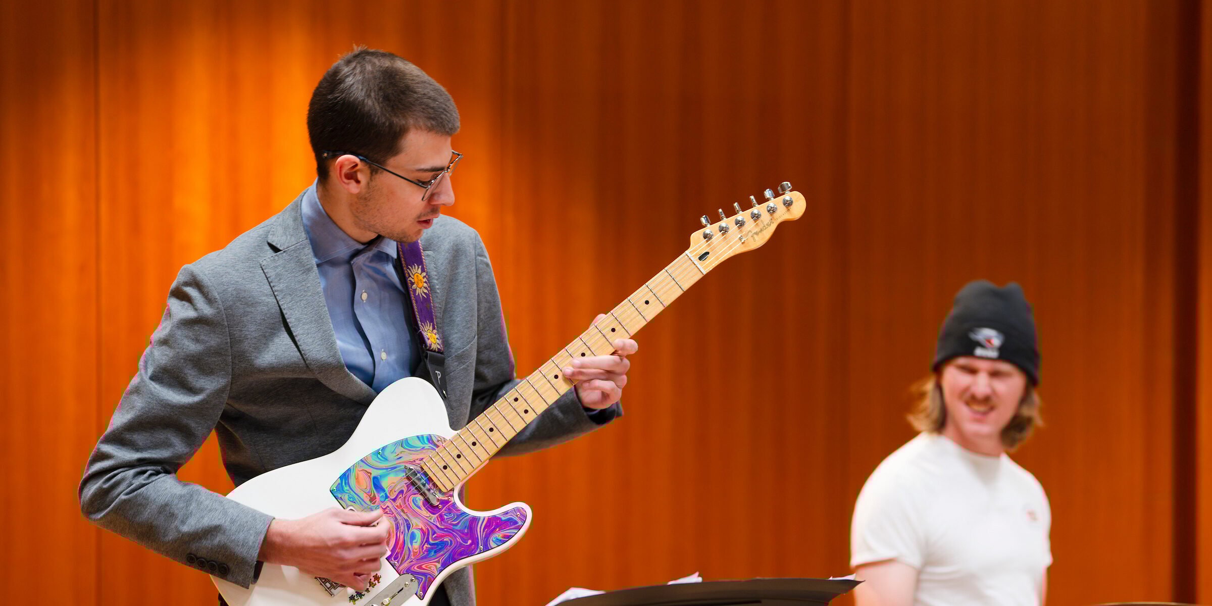 A student plays the electric guitar during practice with the jazz band in Kincaid Concert Hall.