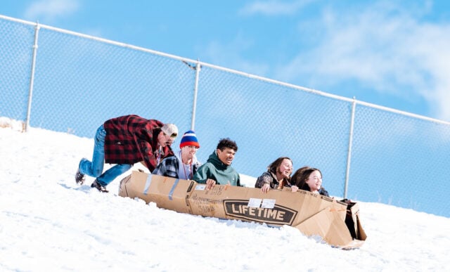 Gary Pierson's ALPS class races down the Green Monster on their DIY cardboard sleds
