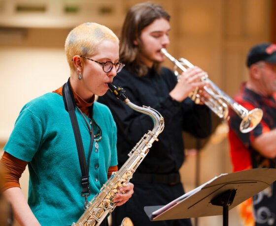 A student plays the saxaphone during practice with the jazz band in Kincaid Concert Hall.