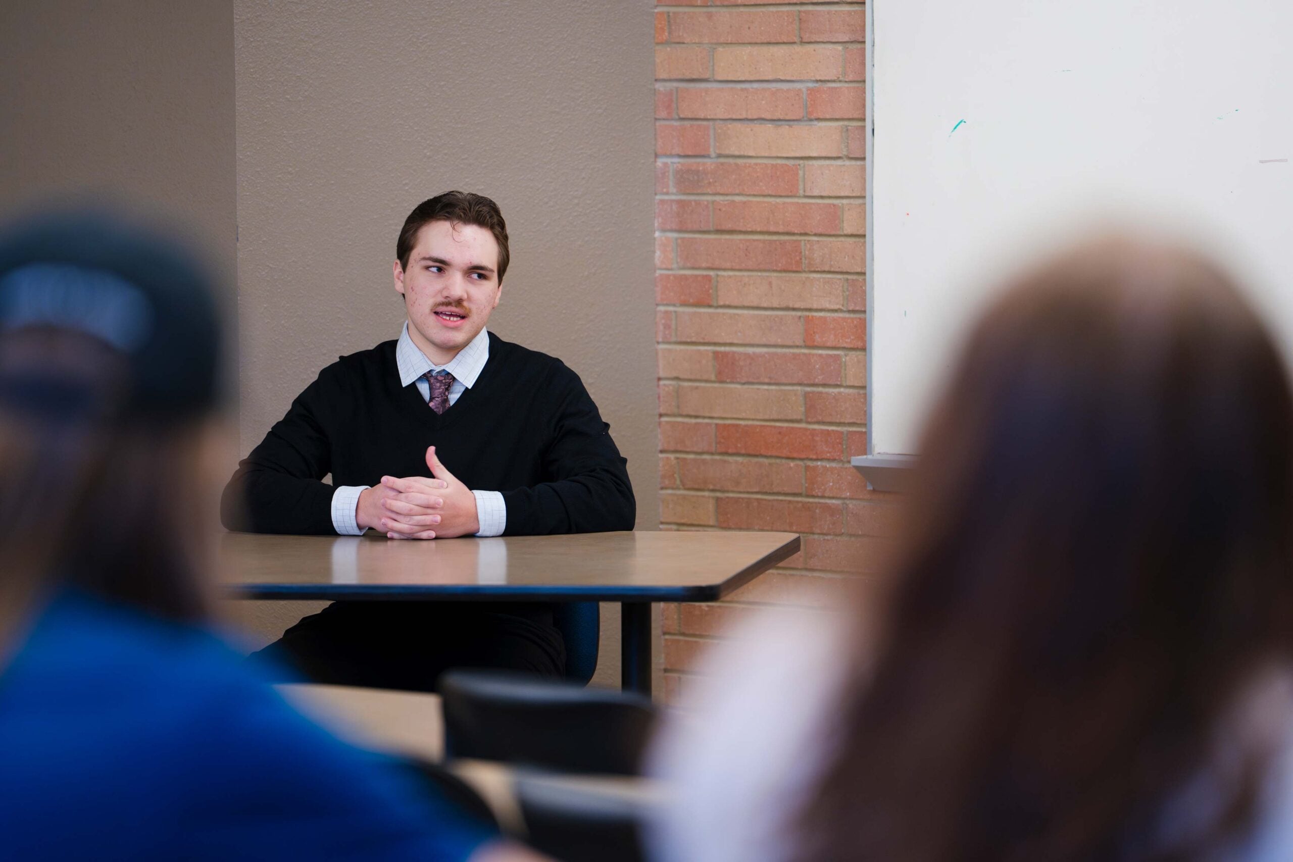 A student acting as a witness gets questioned during a mock trial scrimmage between Western and CMU.