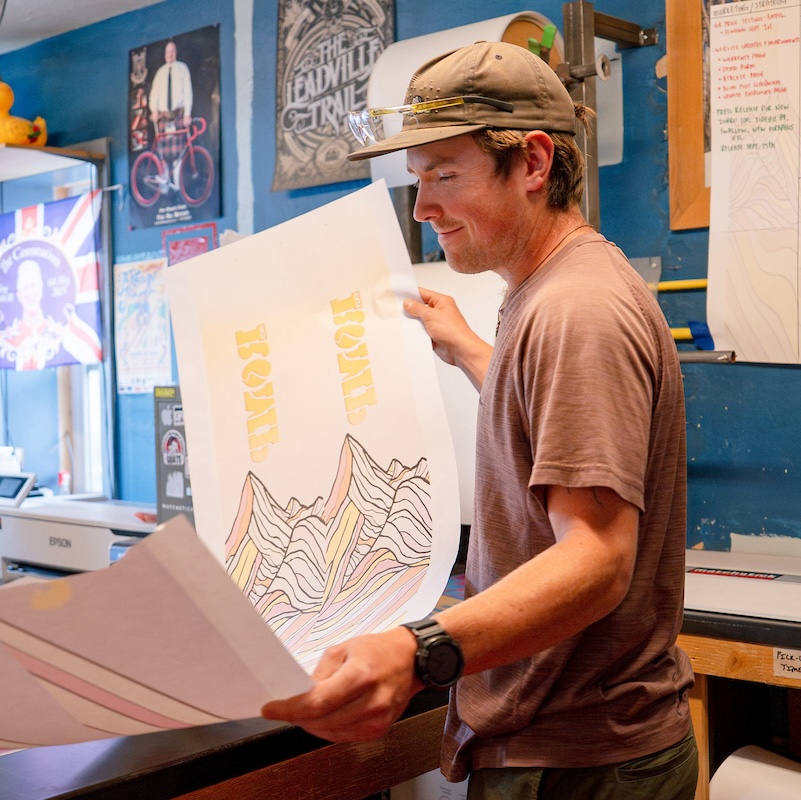 A ROMP employee shows a ski top sheet to the Outdoor Industry MBA cohort.