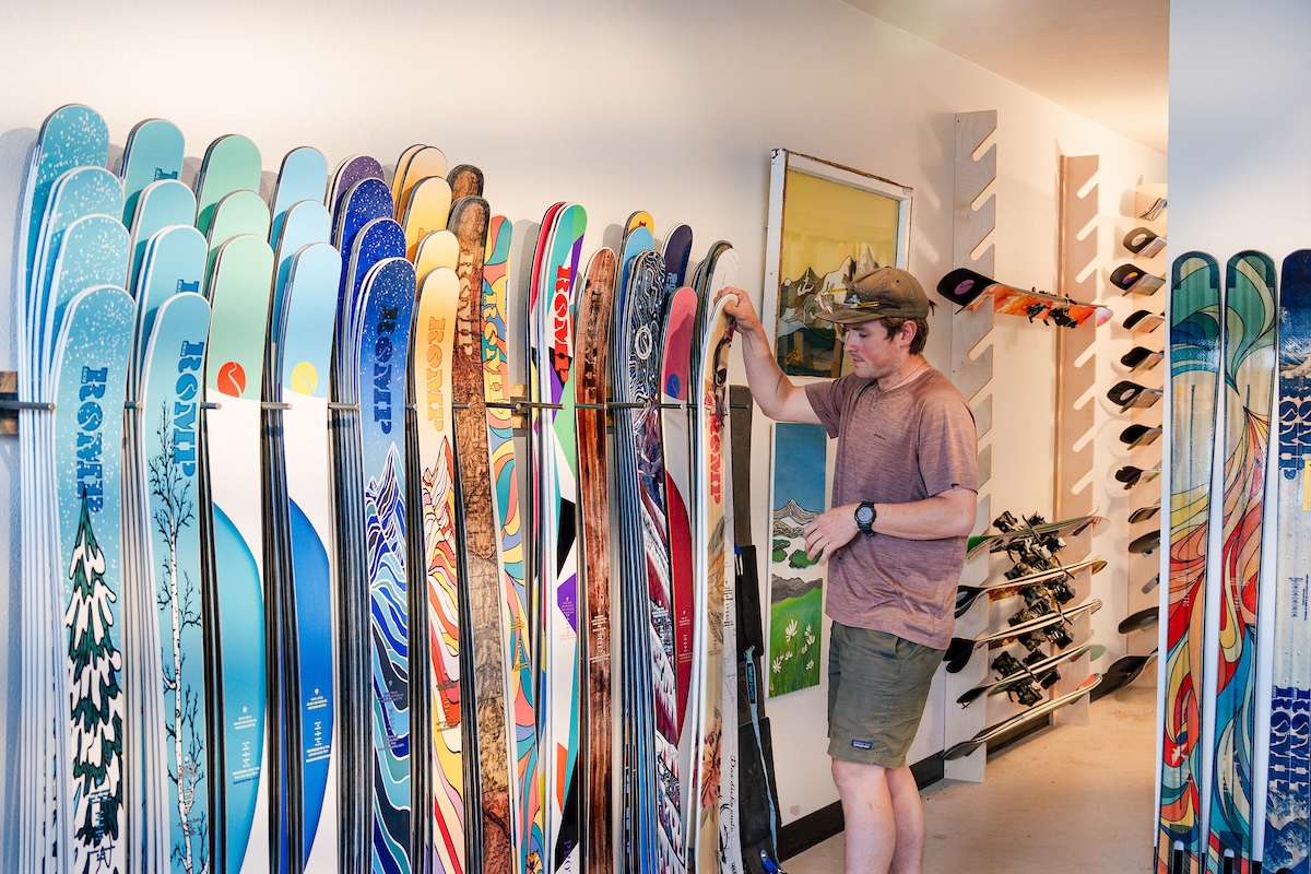 A ROMP employee gives a tour of the ROMP Skis showroom.