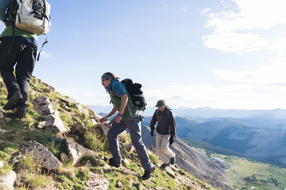 Students taking a hike through the mountains.