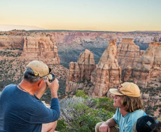 Students identify rock layers with their geology professor at Colorado National Monument.