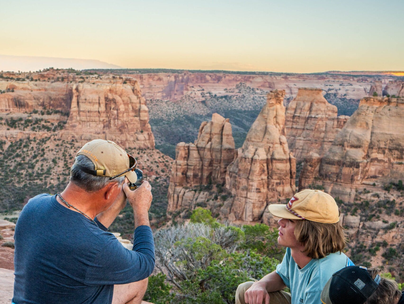 Students identify rock layers with their geology professor at Colorado National Monument.
