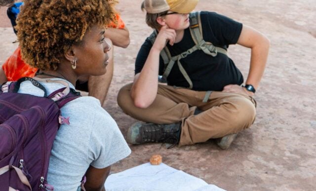 A group of students identify the rock layers in Colorado National Monument.