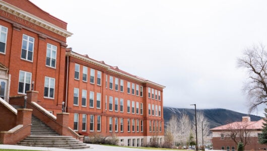 Photo of Taylor Hall and W Mountain from Taylor Lawn on a misty spring afternoon.