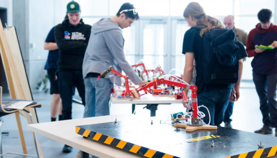 Photo of a mechanical arm or claw built by an engineering student as a class project on display at the End of Semester Celebration.