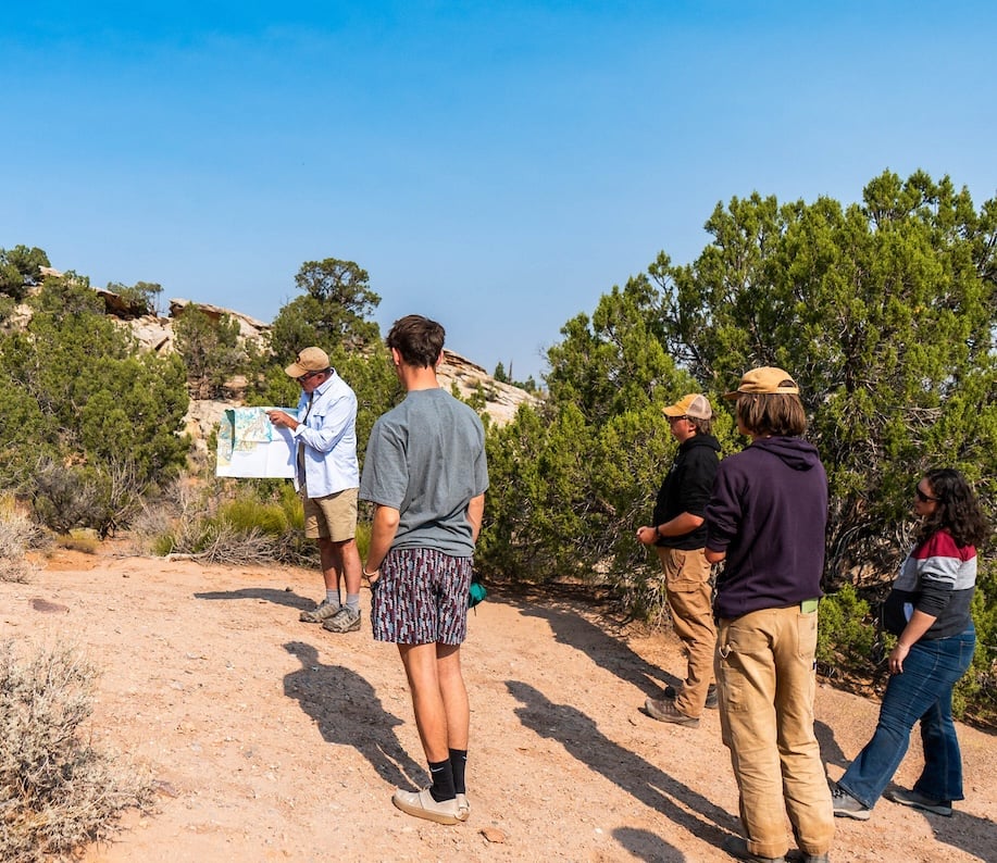Geology professor explaining how a fault arrived at Colorado National Monument.