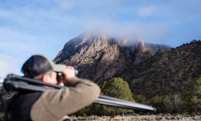 Graduate student, Cody Hinkley, glasses for big horn sheep from the Red Rock Canyon Trail in the Black Canyon of the Gunnison National Park.