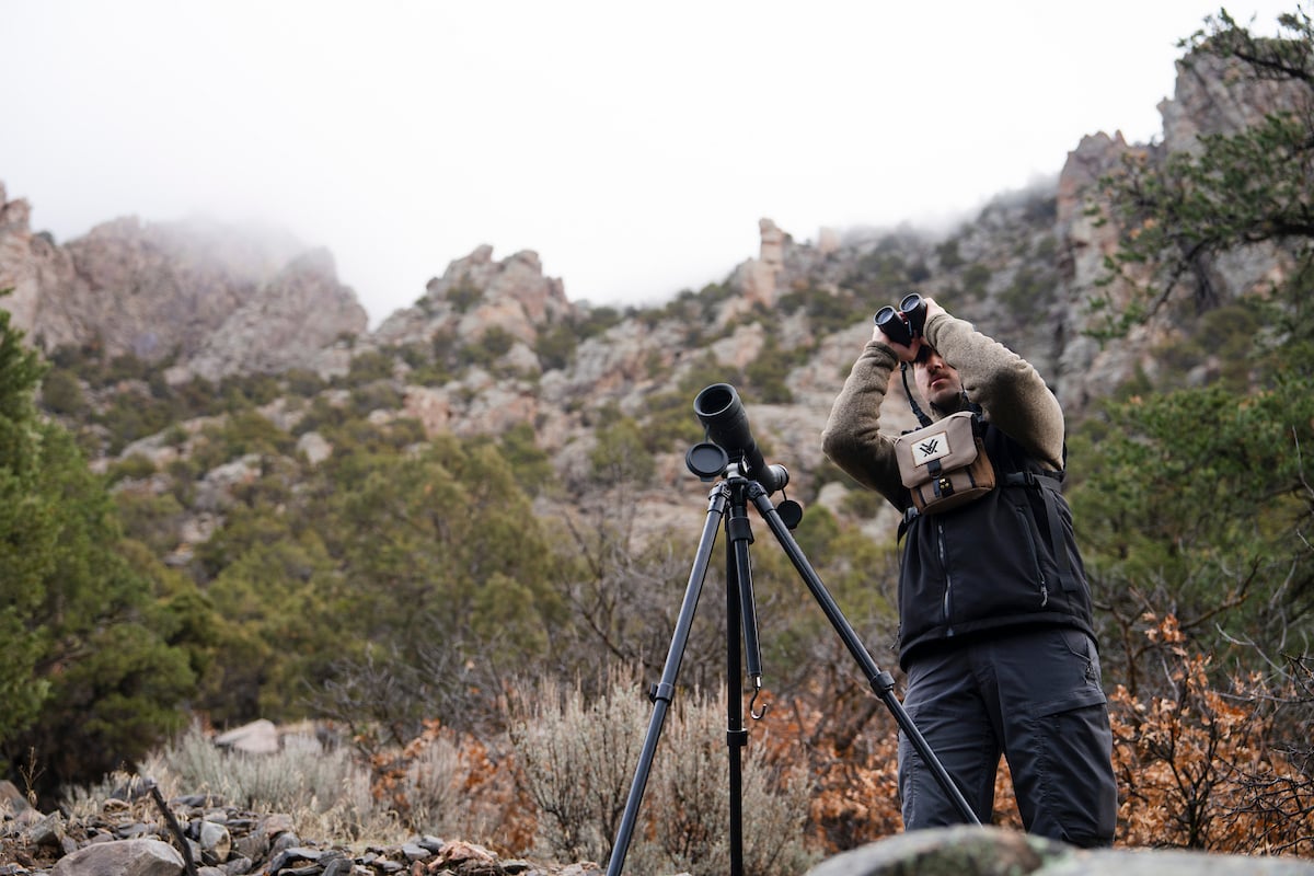 Graduate student, Cody Hinkley, glasses for big horn sheep from the Red Rock Canyon Trail in the Black Canyon of the Gunnison National Park.