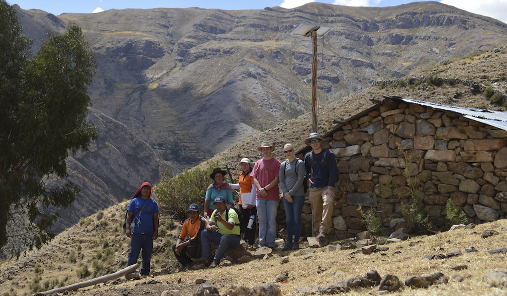 Students and other participants in Light Up The World post for a group photo on site of one of their projects in Peru.