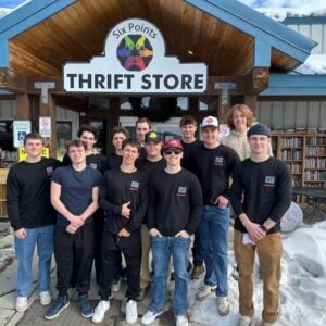 Delta Upsilon Fraternity takes a group photo outside of Six Points Thrift Store in Gunnison.