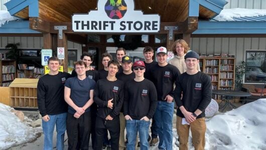 Delta Upsilon Fraternity takes a group photo outside of Six Points Thrift Store in Gunnison.