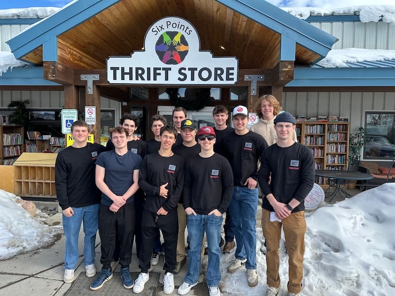 Delta Upsilon Fraternity takes a group photo outside of Six Points Thrift Store in Gunnison.