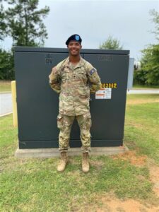 Dashown poses in a military uniform
