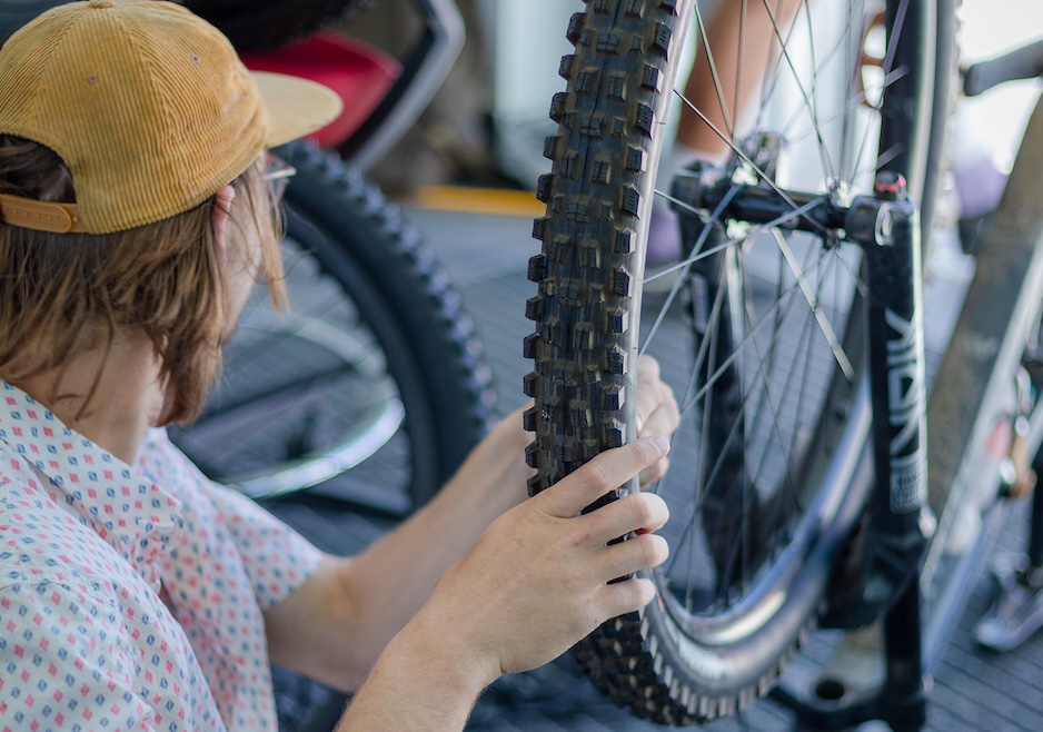 A student intern puts sensors on a mountain bike wheel