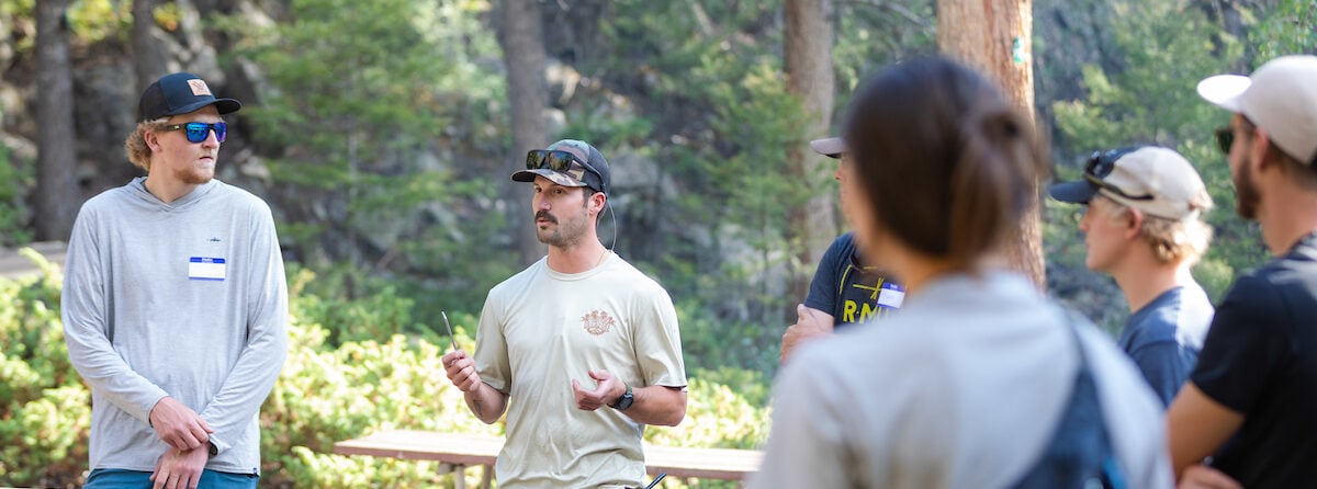 Former Western student and owner of Campfire Ranch, Sam Degenhard introduces himself to Outdoor Industry MBA students during their summer immersion.