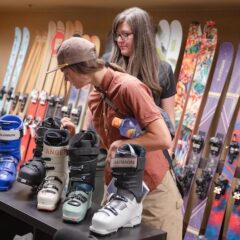 An outdoor inudstry MBA student and faculty member look at ski boots in the Blister Review show room
