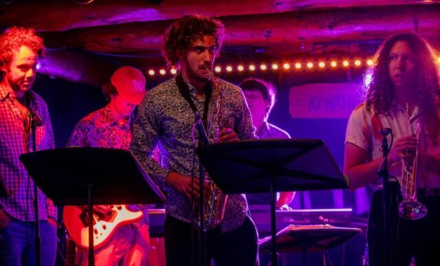 The Western Jazz band plays under ambient lights at the Almont Resort.
