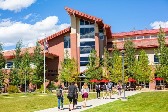 Students walk toward the University Center.