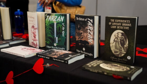Books laid out in display on a table.