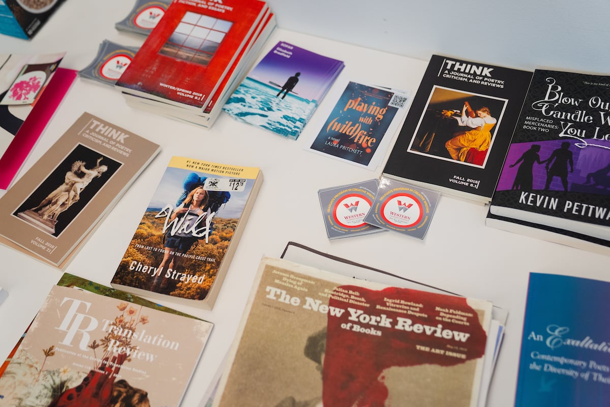 Books laid out in display on a table.