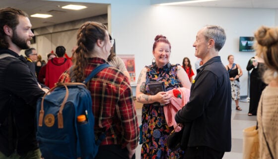 GPCW faculty and students socialize at the GPCW publishing event,