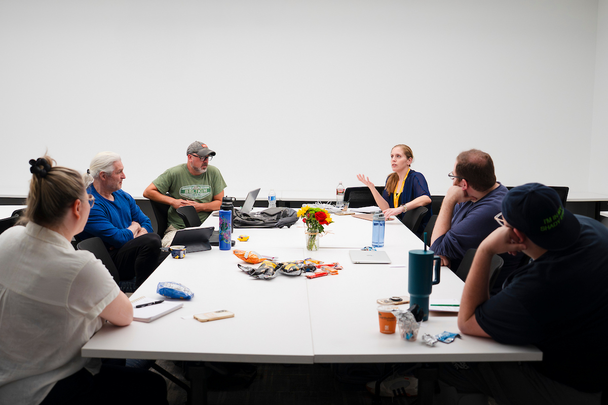 A screenwriting student talks during a discussion in class for the GPCW summer residency.