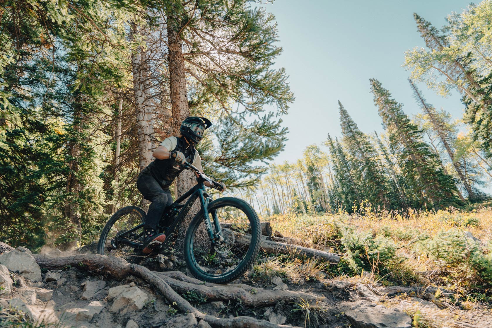 Western student races down a rocky bike trail at Crested Butte.