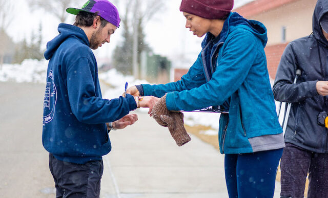 Students check pulses before a running time trial