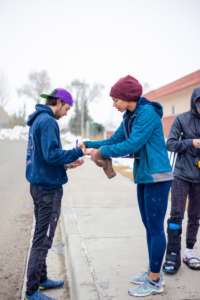 Students check pulses before a running time trial