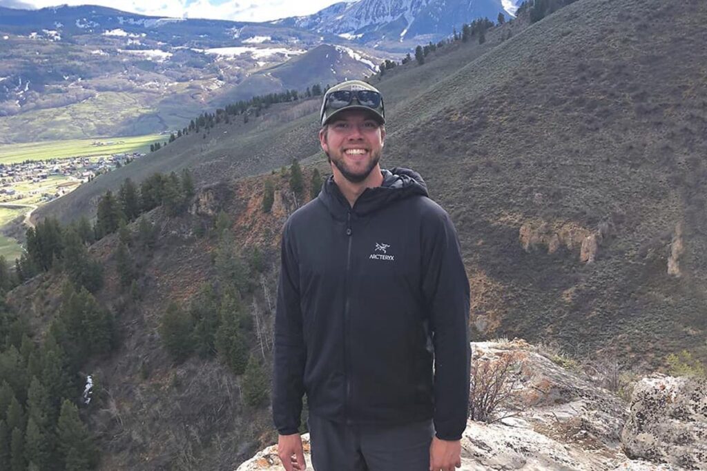 A man stands in the mountains